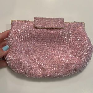 Stylish and adorable pink sparkly clutch with a gold chain